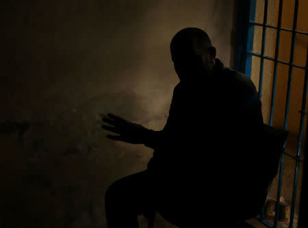 A drug dealer gestures during an interview with Reuters at a Hamas-run prison in Gaza City March 1, 2017. Picture taken March 1, 2017. REUTERS/Mohammed Salem