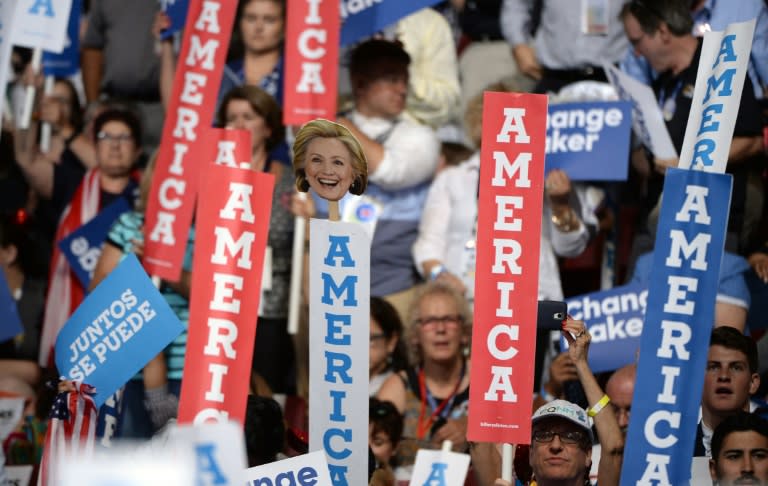 After a tumultuous convention opening, cheers erupted as Hillary Clinton passed the 2,382-delegate threshold needed for the nomination