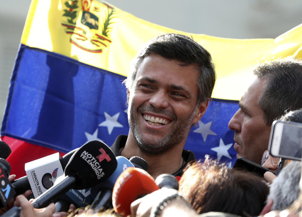 FILE - In this May 2, 2019 file photo, Venezuelan opposition leader Leopoldo Lopez smiles during a press conference at the gate of the Spanish ambassador's residence in Caracas, Venezuela. Lopez left the residence where he had been a guest since April 30, 2019 and is leaving Venezuela people close to the opposition leader said on Saturday, Oct. 24, 2020. (AP Photo/Martin Mejia, File)