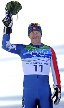 Silver medalist Bode Miller of the United States reacts during the flower ceremony for the Men's super-G