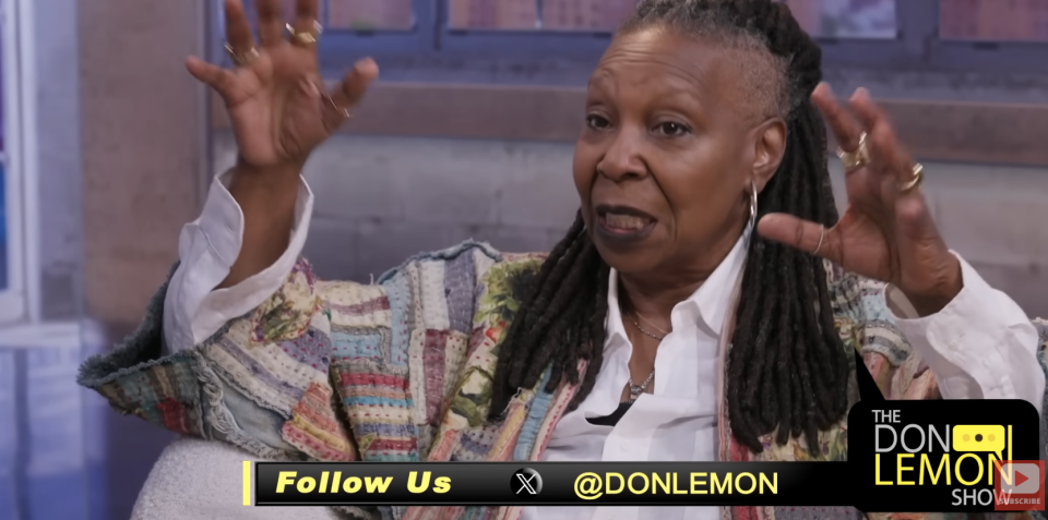 Whoopi Goldberg gestures while speaking on "The Don Lemon Show," wearing a multicolored jacket