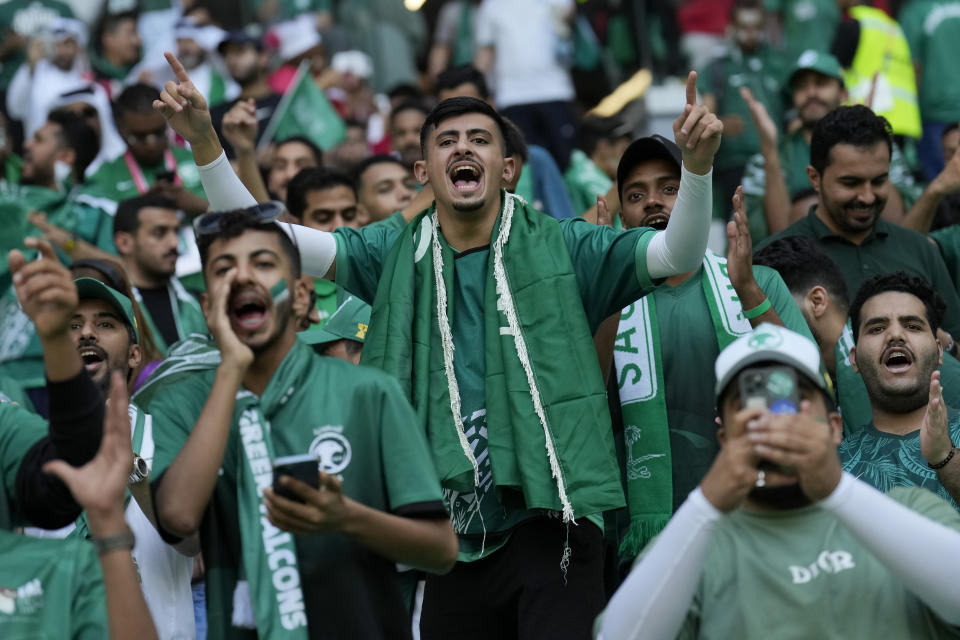 Saudi Arabia fans cheer prior of the World Cup group C soccer match between Poland and Saudi Arabia, at the Education City Stadium in Al Rayyan , Qatar, Saturday, Nov. 26, 2022. (AP Photo/Francisco Seco)