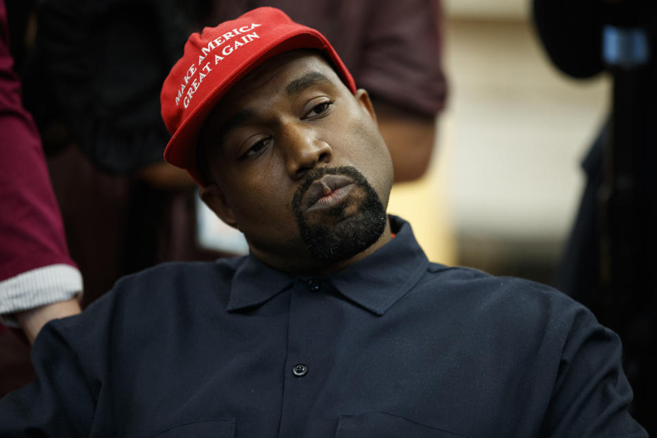 Rapper Kanye West listens to a question from a reporter during a meeting in the Oval Office of the White House with President Donald Trump, Thursday, Oct. 11, 2018, in Washington. (AP Photo/Evan Vucci)