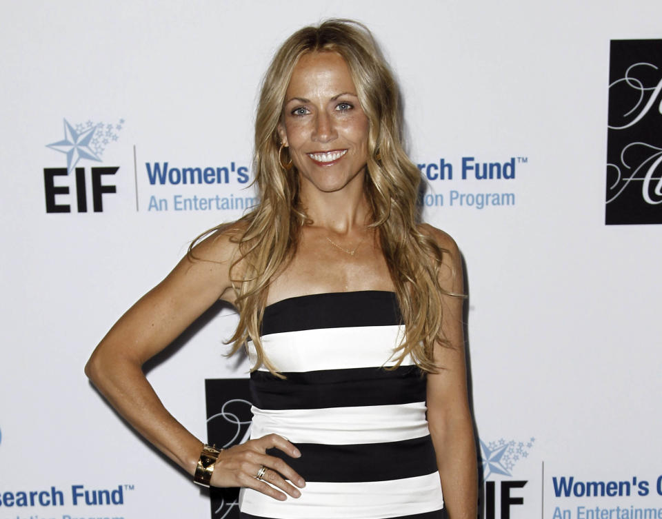 FILE - This April 18, 2012 file photo shows musician Sheryl Crow at the Entertainment Industry Foundation's "Unforgettable Evening" in Beverly Hills, Calif. Crow revealed to an audience that she has a benign brain tumor. She's currently on a nationwide tour and battled breast cancer several years back. (AP Photo/Matt Sayles, file)