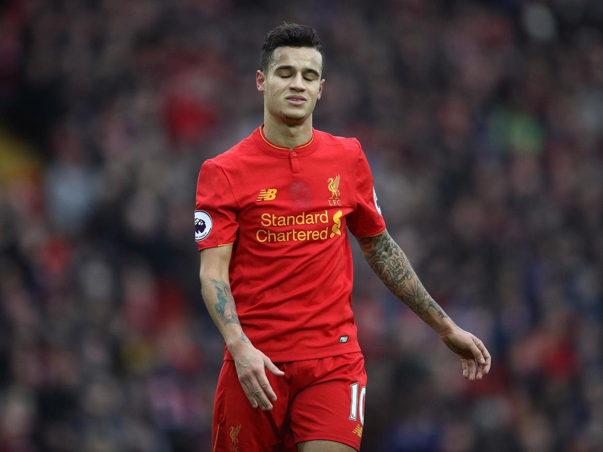 Philippe Coutinho reacts after seeing an effort against Swansea blocked: Getty