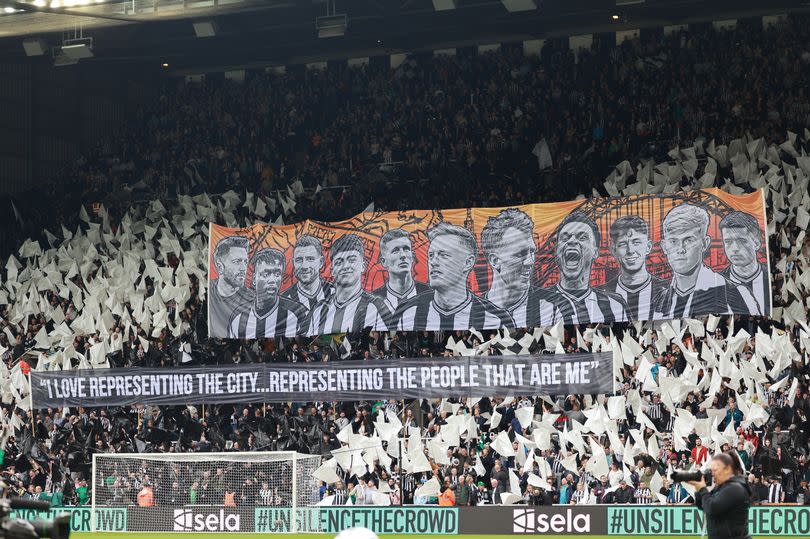 Newcastle United fans display a banner with the club's 'local' heroes before the game against Tottenham