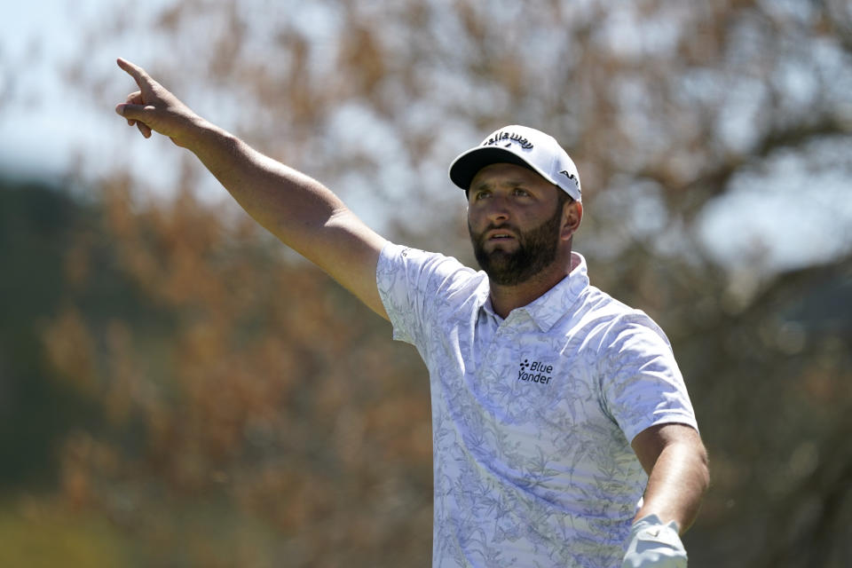 Jon Rahm points after his tee shot on the sixth hole in the second round of the Dell Technologies Match Play Championship golf tournament, Thursday, March 24, 2022, in Austin, Texas. (AP Photo/Tony Gutierrez)