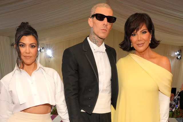 <p>Kevin Mazur/MG22/Getty Images for The Met Museum/Vogue</p> Kourtney Kardashian, Travis Barker, and Kris Jenner