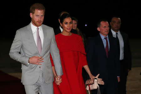 Britain's Prince Harry and Meghan, Duchess of Sussex, are welcomed by British Ambassador to Morocco Thomas Reilly and his wife Alix, at the Casablanca Airport in Casablanca, Morocco, February 23, 2019. REUTERS/Hannah McKay/Pool