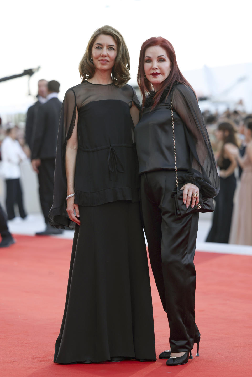 FILE - Director Sofia Coppola, left, and Priscilla Presley pose for photographers at the premiere of "Priscilla" during the 80th edition of the Venice Film Festival in Venice, Italy, on Sept. 4, 2023. (Photo by Vianney Le Caer/Invision/AP, File)r