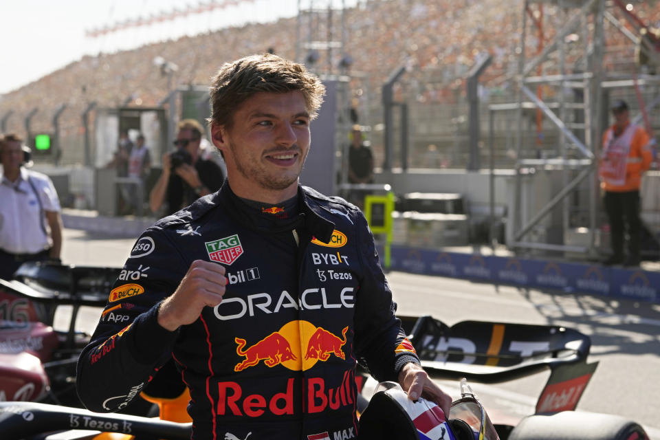 Red Bull driver Max Verstappen of the Netherlands celebrates after clocking the fastest time in the qualifying session ahead of Sunday's Formula One Dutch Grand Prix auto race, at the Zandvoort racetrack, in Zandvoort, Netherlands, Saturday, Sept. 3, 2022. (AP Photo/Peter Dejong)