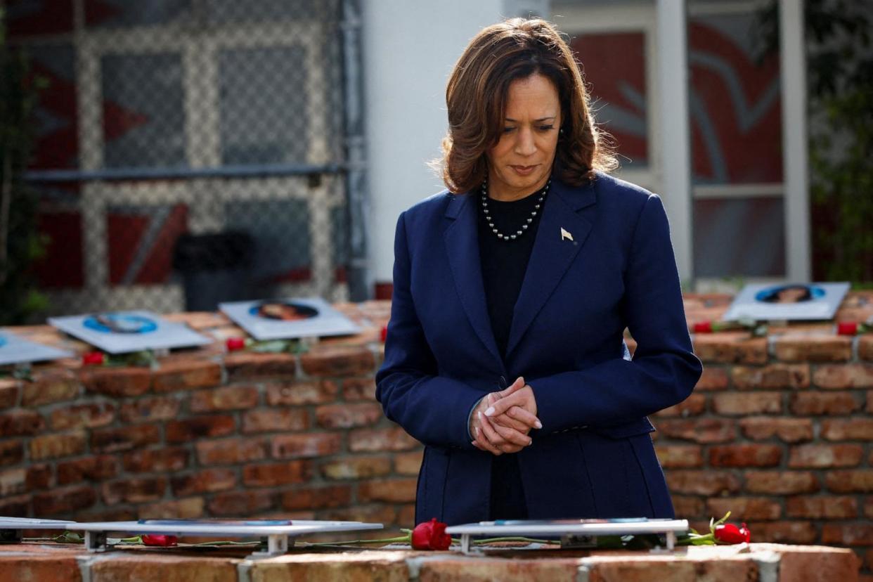 PHOTO: Vice President Kamala Harris pays her respects to the victims of the 2018 school shooting at Marjory Stoneman Douglas High School at the memorial on the campus after meeting with their families in Parkland, FL, March 23, 2024.   (Marco Bello/Reuters)