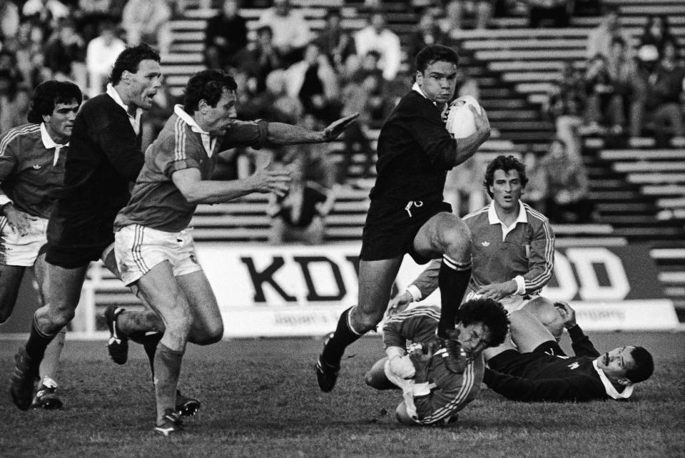 FILE - In this May 22, 1987, file photo Italy's Massimo Mascioletti takes New Zealand's Michael Jones's boot in the mouth in the inaugural Rugby World Cup Pool 3 match between New Zealand and Italy at Eden Park in Auckland, New Zealand. New Zealand Rugby has granted conditional approval, Wednesday, April 14, 2021, for two Pacific Islands teams to join an Australia-New Zealand Super Rugby tournament beginning next year. (AP Photo, File)