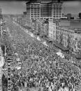 Mardi Gras revelers gather to cheer the King of the celebration during the parade along Canal Street in New Orleans La.,1945. The monarch will parade this year for the first time since 1941. (AP Photo/AJE,file)
