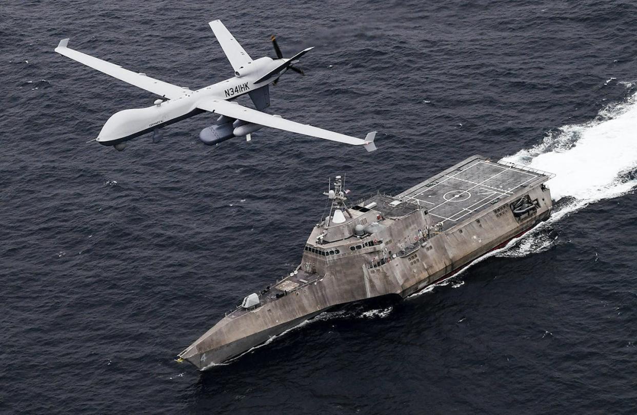 A U.S. surveillance drone flies over the USS Coronado in the Pacific Ocean during an April 2021 drill. <a href="https://newsroom.ap.org/detail/MideastUSNavy/922d4a9e6a1c4e98b117e4076e11343a/photo?Query=MQ-9%20surveillance%20drone&mediaType=photo&sortBy=arrivaldatetime:desc&dateRange=Anytime&totalCount=1&currentItemNo=0" rel="nofollow noopener" target="_blank" data-ylk="slk:U.S. Navy/Chief Mass Communication Specialist Shannon Renfroe;elm:context_link;itc:0;sec:content-canvas" class="link ">U.S. Navy/Chief Mass Communication Specialist Shannon Renfroe</a>