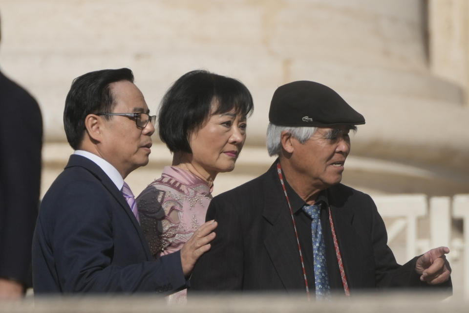 Associated Press Pultizer Price winner Nick Ut, right, and UNESCO ambassador Kim Phuc, center, arrive in St. Peter's Square on the occasion of Pope Francis' weekly general audience at the Vatican, Wednesday, May 11, 2022. (AP Photo/Gregorio Borgia