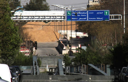 A road sign that shows the direction to Jobar district is pictured in the east of the capital Damascus, in this handout picture provided by SANA on March 19, 2017, Syria. SANA/Handout via REUTERS