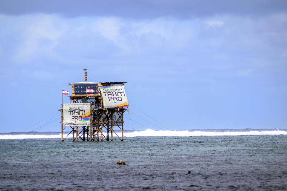 FILE - The judges' tower is pictured during the Tahiti Pro surfing competition, a test event for the Paris 2024 Olympics Games, at Teahupo'o beach, French Polynesia in the Pacific Ocean, Friday, Aug. 11, 2023. Organizers of the Paris Olympics said Wednesday Dec.20, 2023 that building work will continue on a new tower for judges and TV cameras at the surfing venue in Tahiti despite the sport's governing body saying it no longer supports the controversial project. (AP Photo/Esther Cuneo, File)