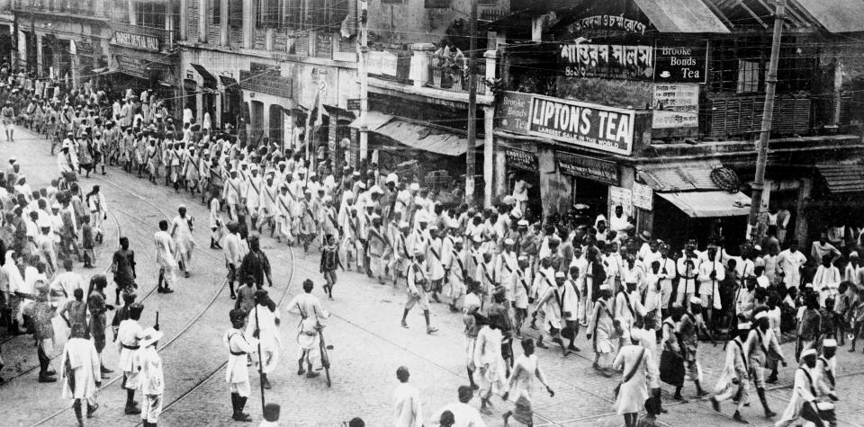 (Original Caption) Uprisings in Calcutta Worry England. The uprisings among the natives in Calcutta has caused much concern in England. The great plan devised by Gandhi, the native leader, for a general upheaval against the British authority in India has gathered great force and his arrest followed. Here is a view of the native procession after the arrest of Gandhi.