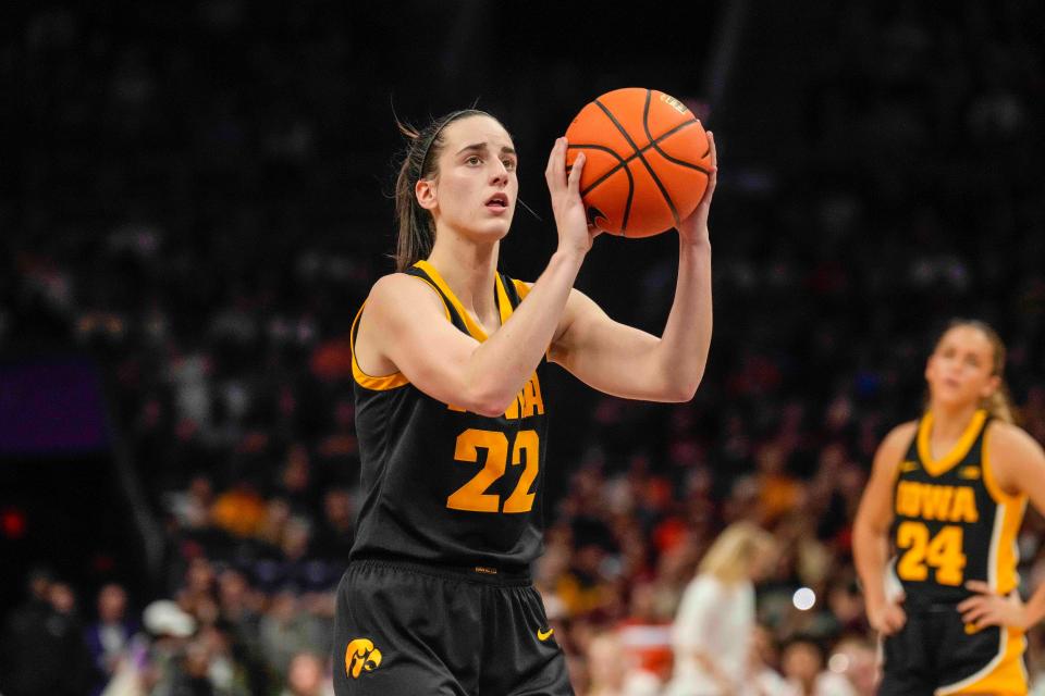 Iowa Hawkeyes guard Caitlin Clark (22) sets up for a free throw against the Virginia Tech Hokies at Spectrum Center.