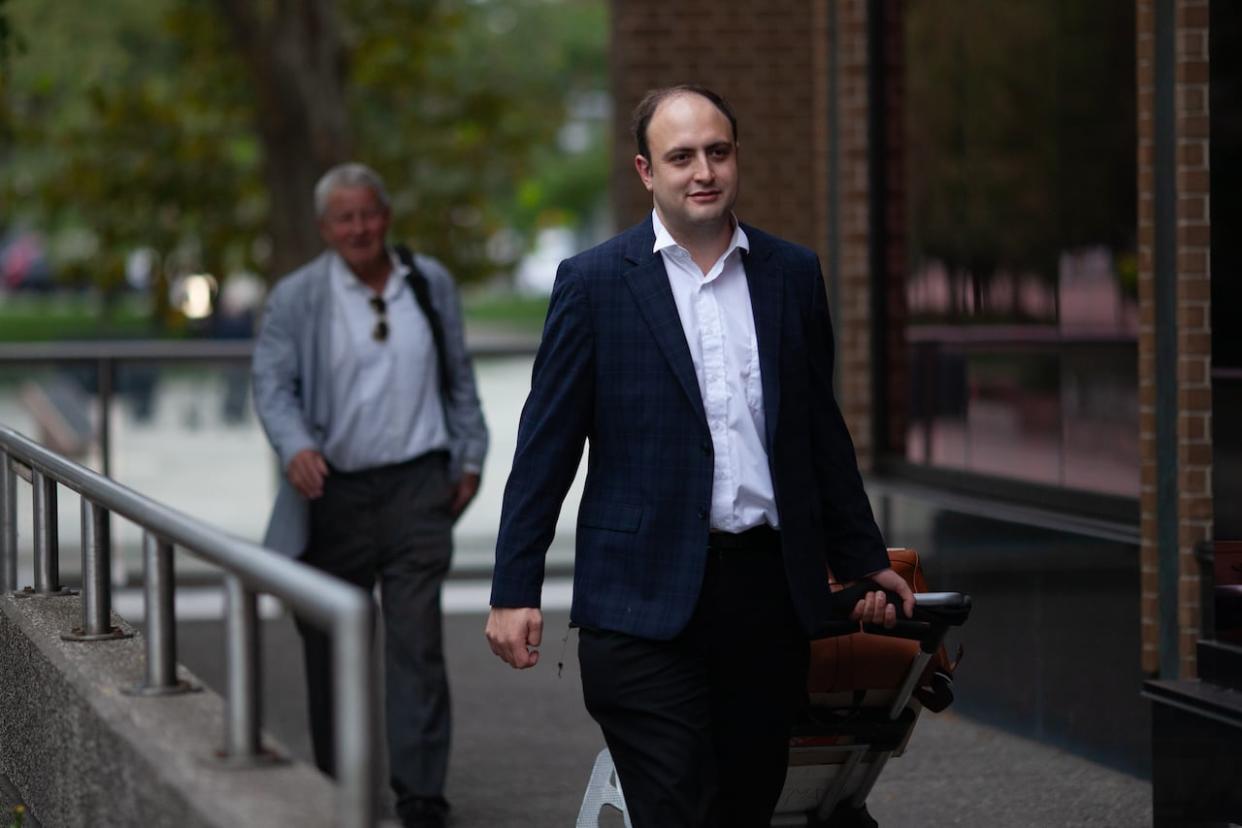 Defence lawyers for Nathaniel Veltmen, Peter Ketcheson and Christopher Hicks, left, leave the Ontario Superior Court of Justice in Windsor on Sept. 11 after the first day of trial. On Tuesday, the defence and Crown gave closing arguments in the 10-week trial. (Dax Melmer/CBC - image credit)