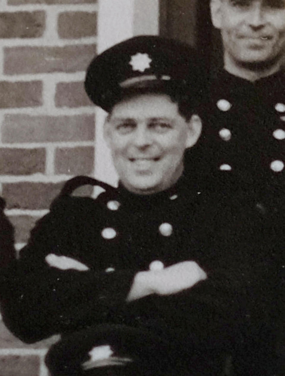 John Thompson, pictured when in the Fire Service during the 1950's. A 91-year-old was conned by a fraudster who convincingly posed as a bank branch manager (SWNS)