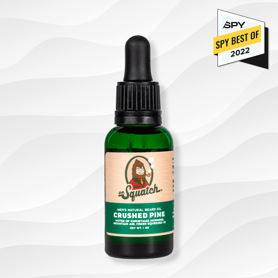 the dr squatch beard oil crushed pine scent against a white wavy background