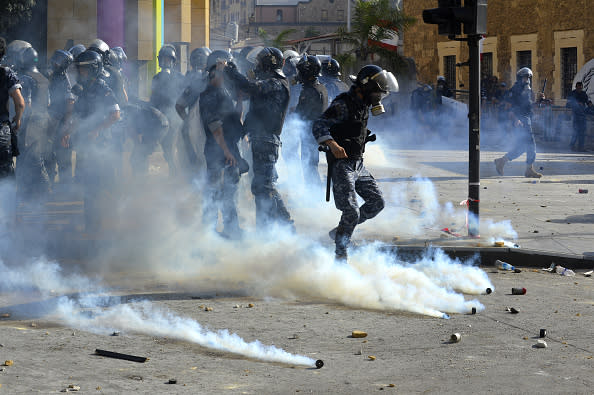 Demonstrators clash with Lebanese riot police as riot police intervene them with tear gas canisters during a protest against government at the Martyrs' Square after the deadly explosion at the Port of Beirut led to massive blasts on 4th August in Beirut, Lebanon.