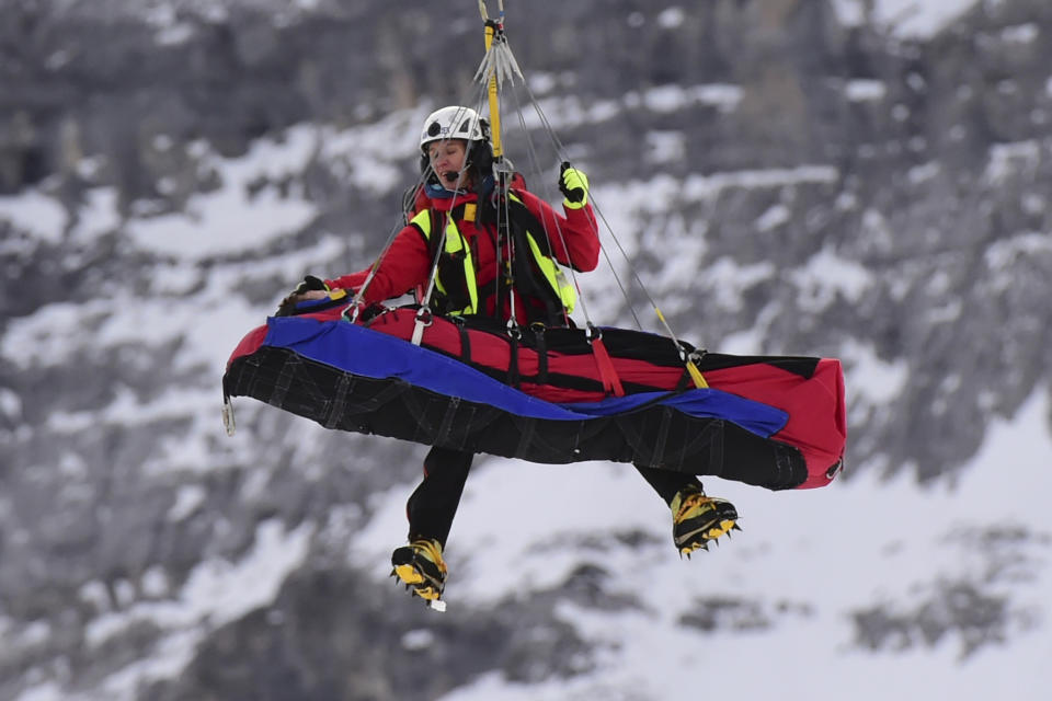 Norway's Adrian Smiseth Sejersted is airlifted on a helicopter after crashing during during the first run of an alpine ski, men's World Cup combined in Wengen, Switzerland, Friday, Jan. 17, 2020. (AP Photo/Marco Tacca)