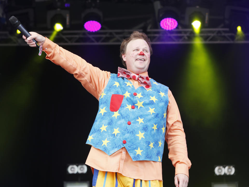 Justin Fletcher performs as Mr. Tumble at Camp Bestival at Lulworth Castle on Saturday, August 2, 2014, in Dorset, England. Thousands of music fans have arrived to the festival to see headliners James, De La Soul and Basement Jaxx. (Photo by Jim Ross/Invision/AP Images)