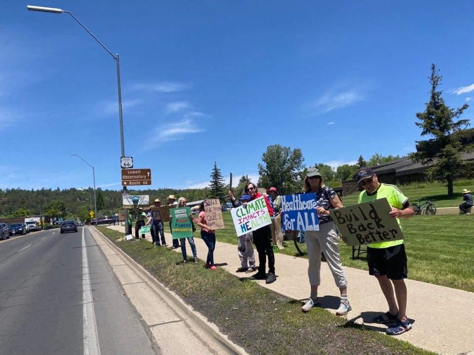 Members of Flagstaff Community First demonstrate outside of City Hall on June 10, 2023, to protest moving forward with the plan for the new hospital.