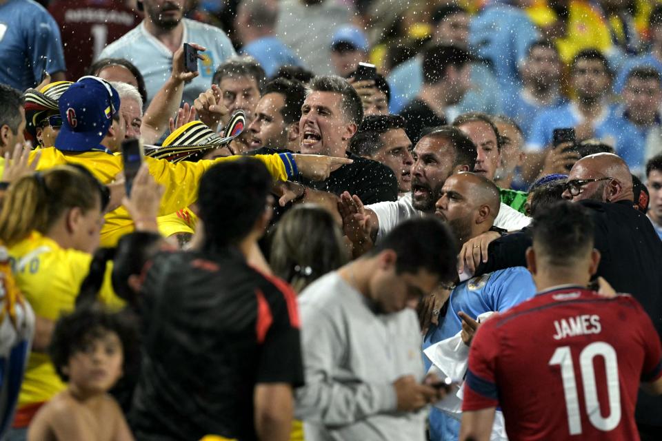 Supporters for Colombia and Uruguay clash following the conclusion of Wednesday night's Copa America semifinal at Bank of America Stadium in Charlotte, North Carolina.