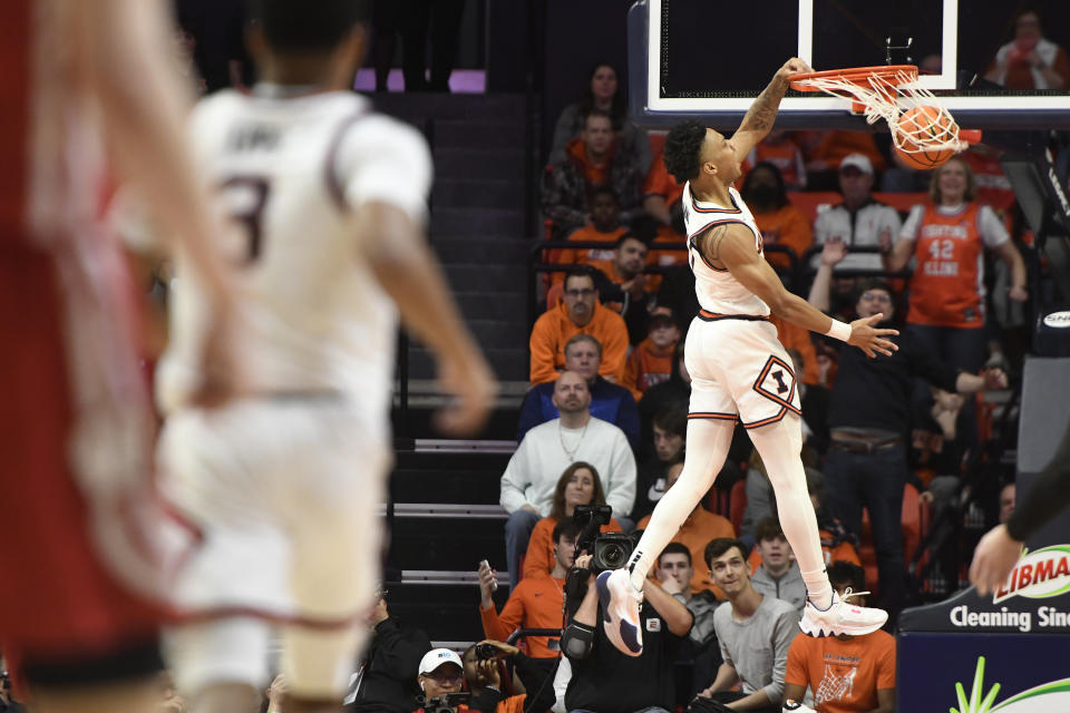 Illinois' Terrence Shannon Jr. dunks during the second half of an NCAA college basketball game against Wisconsin, Saturday, Jan. 7, 2023, in Champaign, Ill. (AP Photo/Michael Allio)