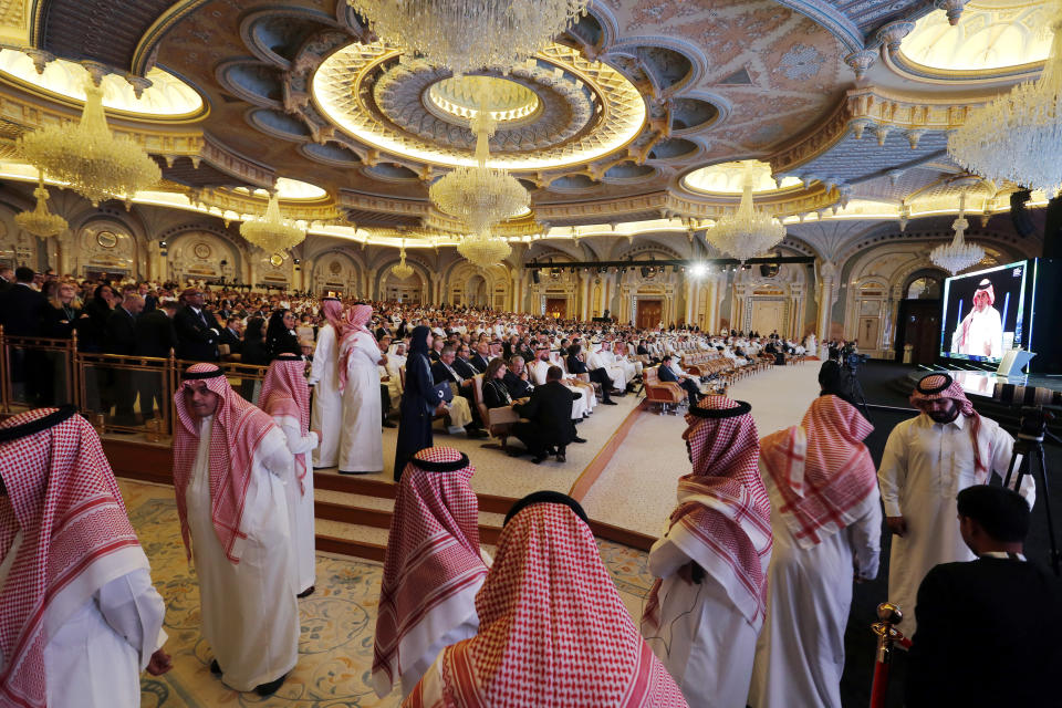 FILE - In this Tuesday, Oct. 23, 2018 file photo, Saudi bodyguards patrol during the opening of the Future Investment Initiative conference, in Riyadh, Saudi Arabia. Whether pressured to speak up after receiving assistance or making a diplomatic play for more, some African countries are expressing support for Saudi Arabia as shocking details in the killing of Jamal Khashoggi approached a crescendo, with South Sudan issuing a rare statement praising the Saudi position to defuse the crisis as "honorable". (AP Photo/Amr Nabil, File)