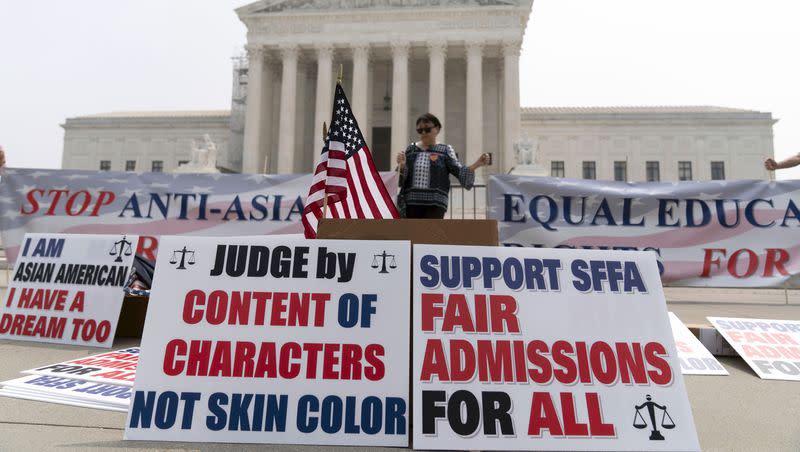 A person protests outside of the Supreme Court in Washington, Thursday, June 29, 2023. The Supreme Court on Thursday struck down affirmative action in college admissions, declaring race cannot be a factor and forcing institutions of higher education to look for new ways to achieve diverse student bodies.