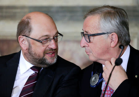 European Parliament President Martin Schulz (L) and European Commission President Jean-Claude Juncker talk during a meeting at the Capitol Hill in Rome, Italy, May 5, 2016. REUTERS/Max Rossi