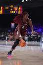 In this photo provided by Bahamas Visual Services, South Carolina forward Aliyah Boston (4) plays against UConn during an NCAA college basketball game at Paradise Island, Bahamas, Monday, Nov. 22, 2021. Aliyah Boston had 22 points and 15 rebounds to help No. 1 South Carolina beat second-ranked UConn 73-57 to win the inaugural Battle 4 Atlantis tournament championship. (Tim Aylen/Bahamas Visual Services via AP)