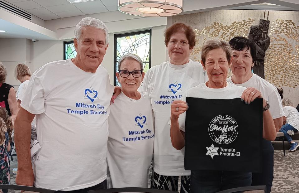 At Mitzvah Day, volunteers Barry and Barbara Gerber, left, Adrienne Krouse, Ellen Klein and Loretta Bauman prepared chemotherapy comfort bags for adults and children with cancer. Shaffer’s American Custom Golf Carts Sarasota paid for the bags.