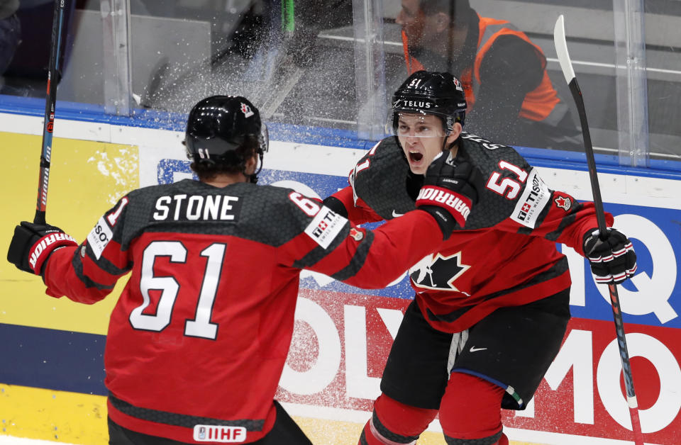 Canada's Mark Stone celebrates with Troy Stecher, right, after scoring his side's first goal during the Ice Hockey World Championships semifinal match between Canada and Czech Republic at the Ondrej Nepela Arena in Bratislava, Slovakia, Saturday, May 25, 2019. (AP Photo/Petr David Josek)