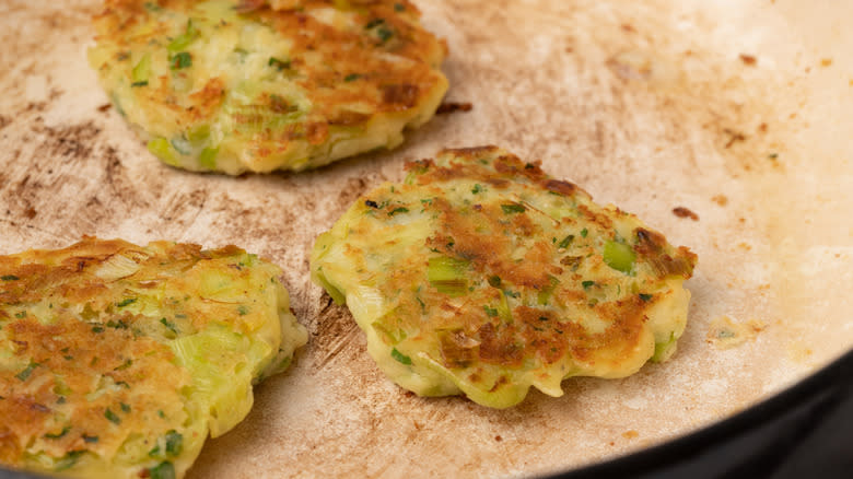 frying herby cheddar leek fritters