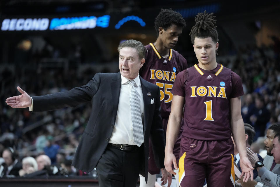 Iona head coach Rick Pitino, left, speaks with Walter Clayton Jr. (1) in the first half of a first-round college basketball game against Connecticut in the NCAA Tournament, Friday, March 17, 2023, in Albany, N.Y. (AP Photo/John Minchillo)