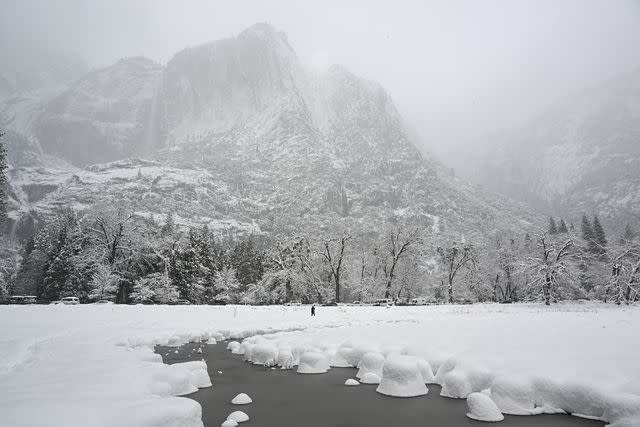 <p>Tayfun Coskun/Getty Images</p> Snow covered Yosemite National Park in California after storm on February 23, 2023