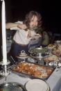 <p>Aerosmith guitarist, Brad Whitford, digs into a backstage rider buffet. </p>