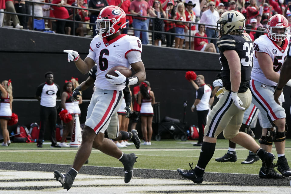 Georgia running back Kenny McIntosh (6) scores a touchdown against Vanderbilt in the second half of an NCAA college football game Saturday, Sept. 25, 2021, in Nashville, Tenn. Georgia won 62-0. (AP Photo/Mark Humphrey)