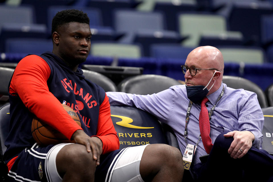 NEW ORLEANS, LOUISIANA - NOVEMBER 13: Zion Williamson #1 of the New Orleans Pelicans speaks with David Griffin executive vice president of basketball operations for the New Orleans Pelicans at Smoothie King Center on November 13, 2021 in New Orleans, Louisiana. NOTE TO USER: User expressly acknowledges and agrees that, by downloading and or using this photograph, User is consenting to the terms and conditions of the Getty Images License Agreement. (Photo by Sean Gardner/Getty Images)