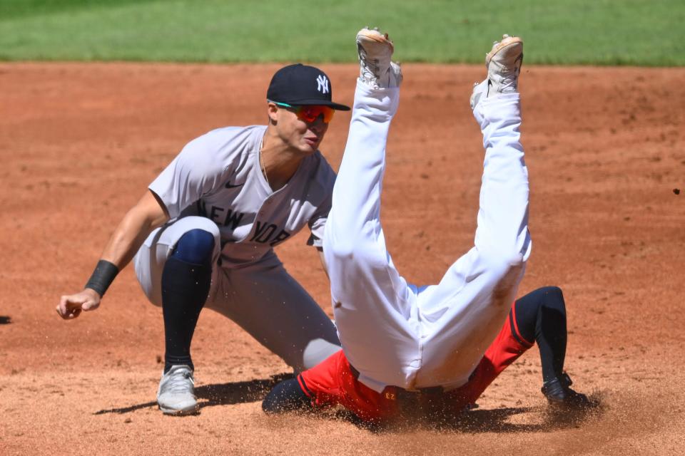 April 13: Cleveland Guardians catcher Bo Naylor is tagged out by New York Yankees shortstop Anthony Volpe while attempting to steal second base in the second inning.