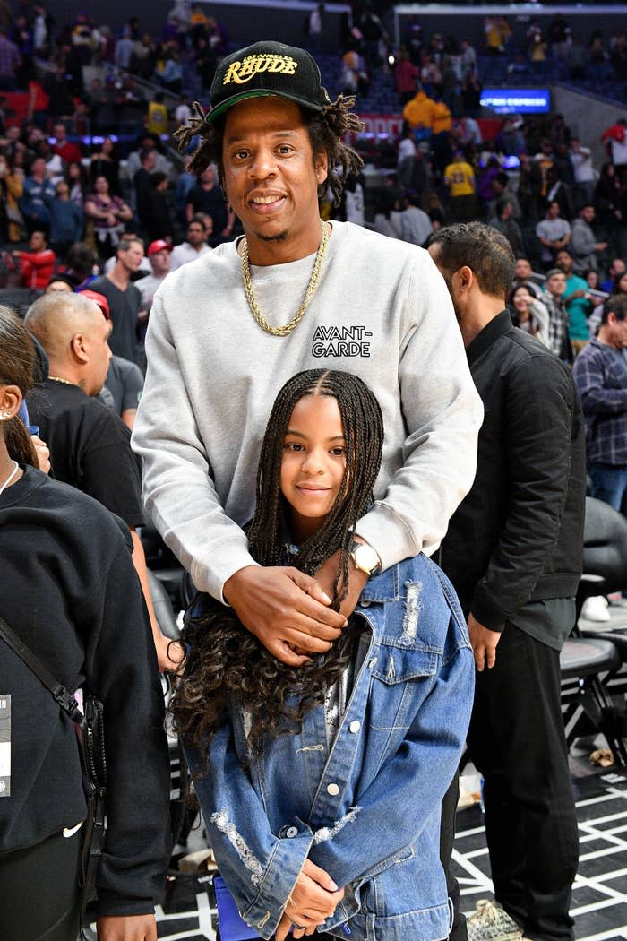 Jay-Z and Blue Ivy at a basketball game between Los Angeles Clippers and the Los Angeles Lakers