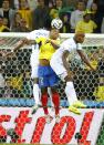 Ecuador's Jorge Guagua (C) fights for the ball with Brayan Beckeles (R) of Honduras and his teammate Carlo Costly during their 2014 World Cup Group E soccer match at the Baixada arena in Curitiba June 20, 2014. REUTERS/Stefano Rellandini (BRAZIL - Tags: SOCCER SPORT WORLD CUP)