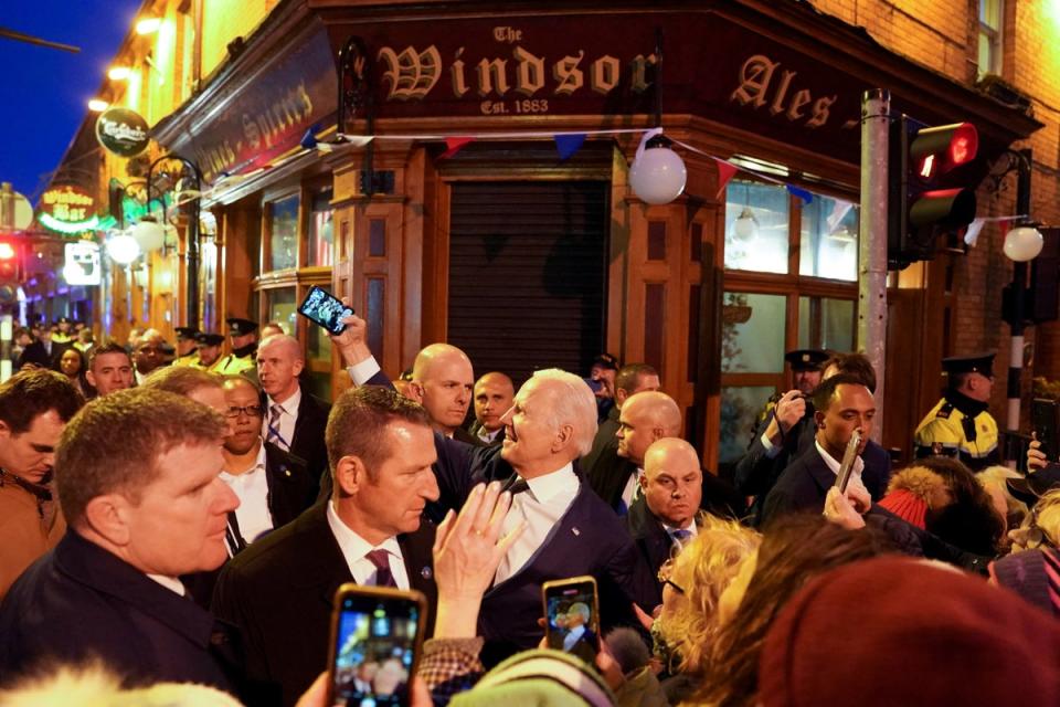 Joe Biden takes a selfie outside a pub during his visit in Dundalk, Ireland (REUTERS)