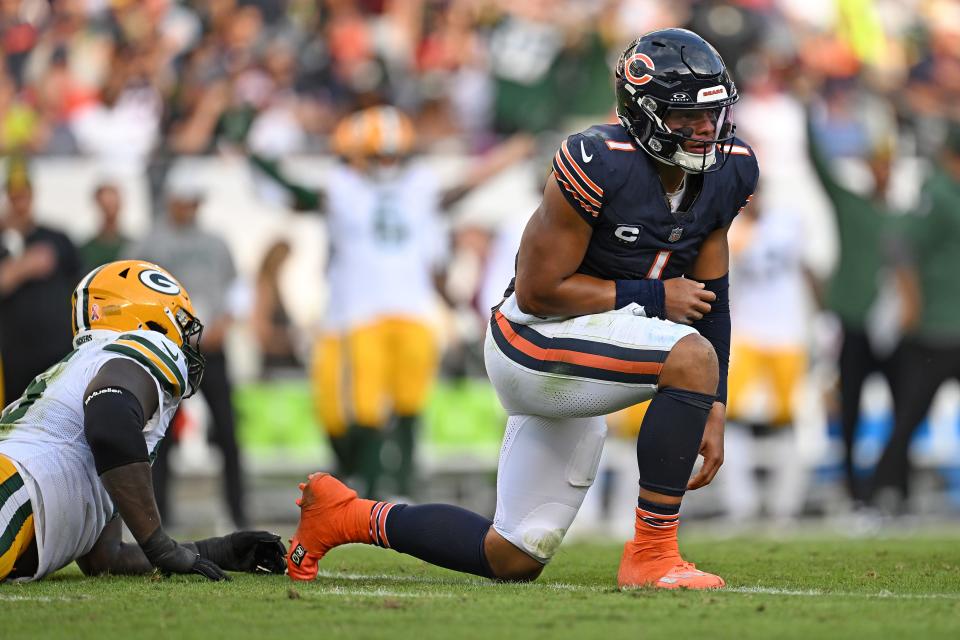 Justin Fields #1 of the Chicago Bears reacts after fumbling the ball against the Green Bay Packers during the second half at Soldier Field on September 10, 2023 in Chicago, Illinois.